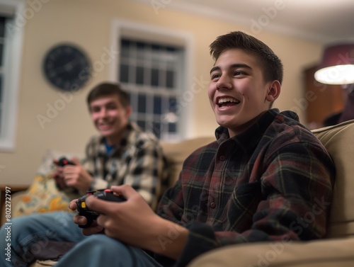 Two smiling teenage boys engaged in a fun gaming session at home.
