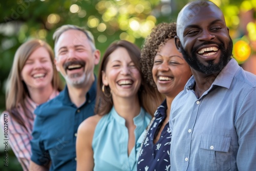 Group of happy multiethnic people standing in a row and laughing
