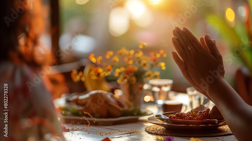 Woman hands praying to god while sitting at the table in the cafe photo