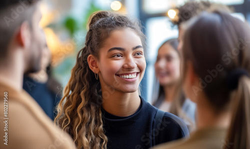 Young Woman Smiling in a Social Gathering