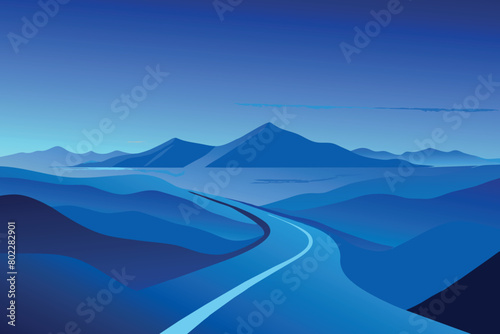 A blue mountain range with a road running through it