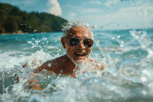 Old man swimming in the sea, enjoying the summer breeze, beach relaxation.