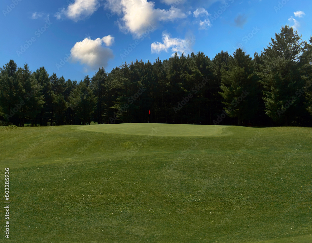A beautiful view of lush green golf course surrounded by beautiful hills with pine trees at Pahalgam Kashmir India. A beautiful view of lush green golf course surrounded by beautiful hills with pine trees at Pahalgam Kashmir India.