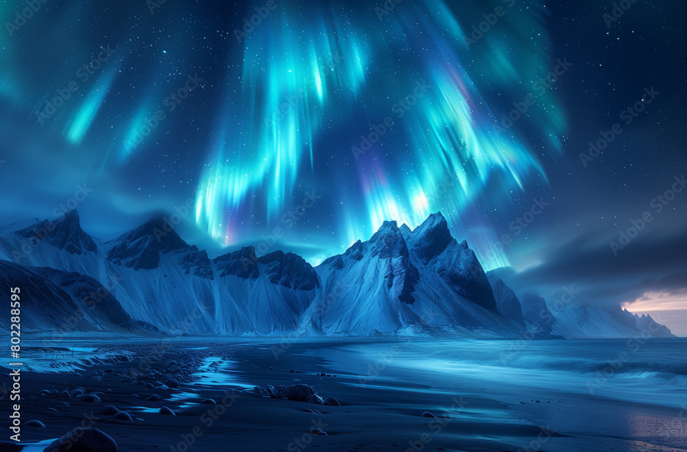 Fototapeta premium The colorful aurora borealis lights up the night sky above a towering mountain range, creating a stunning visual display of natural beauty.