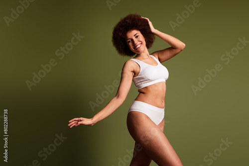 No filter photo of carefree lady underwear lingerie enjoying women rights emtpy space isolated khaki color background