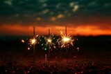 Burning sparklers on the background of the setting sun,  New year concept
