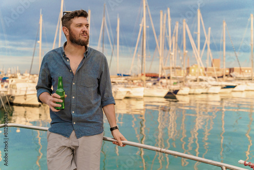Man Relaxing with Beer on Yacht - Marina Leisure (ID: 802306523)