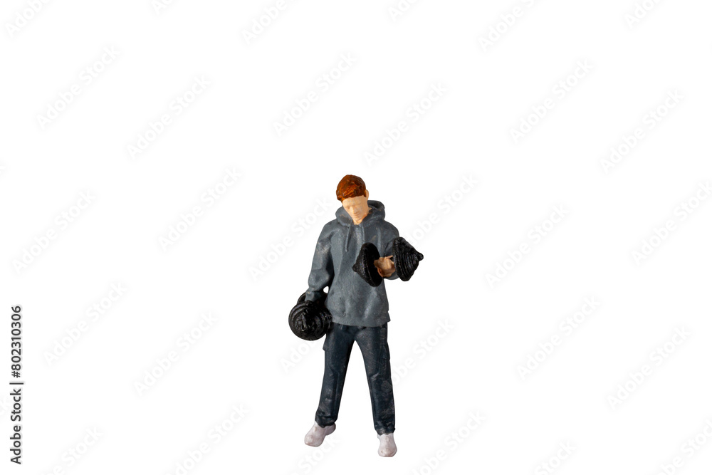 Miniature people , Young man lifting weights Isolated on white background with clipping path Miniature people , Young man lifting weights Isolated on white background with clipping path