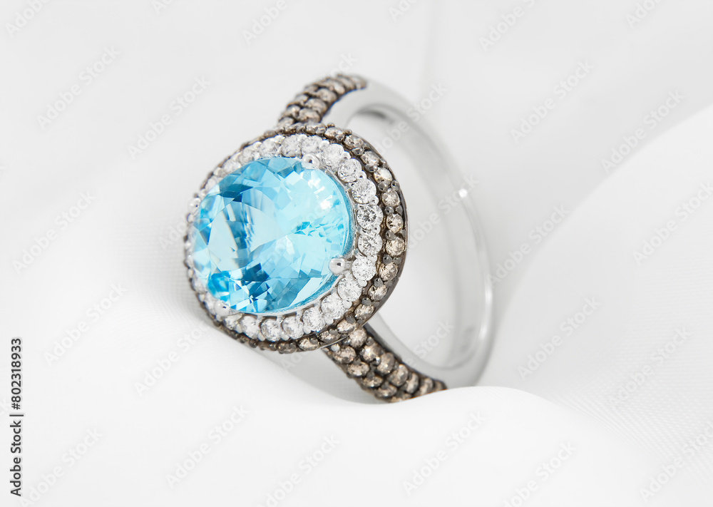 Aquamarine and Diamond White Gold Ring Displayed on Silk. Aquamarine and Diamond White Gold Ring Displayed on Silk.