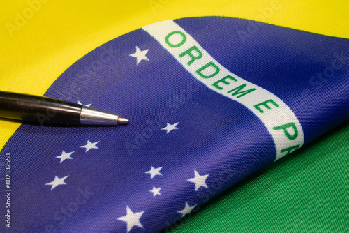 LAURO DE FREITAS, BRAZIL - April 26, 2024 : brazilian flag close to the pencil photo