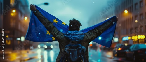 EU Elections 2024 Civic Engagement, Young Voter Carrying European Union Flag in Urban Night Scene, Symbol of Political Commitment and Solidarity photo