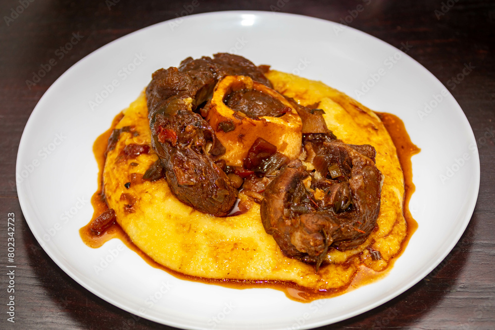 Traditional rustic recipe for ossobuco with polenta Traditional rustic recipe for ossobuco with polenta