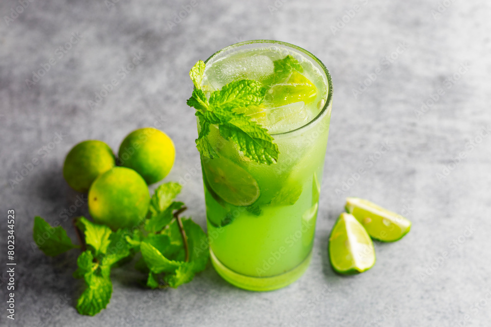 Fototapeta premium selective focus of Mint Mojito with grey background.