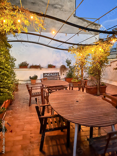 фотографія A rooftop dining terrace at dusk in Bari, Puglia in Italy