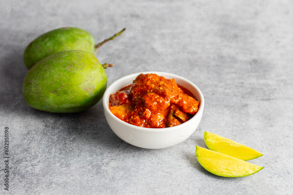 selective focus of Mango Pickle with green sliced mango. 