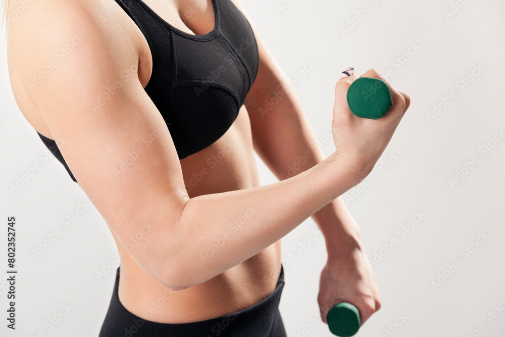 Fototapeta premium Close up of a woman lifting weights