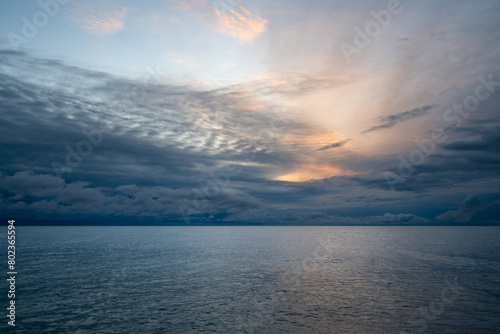 View of the Black Sea on the coast of Sochi against the sunset sky, Sochi, Krasnodar Krai, Russia