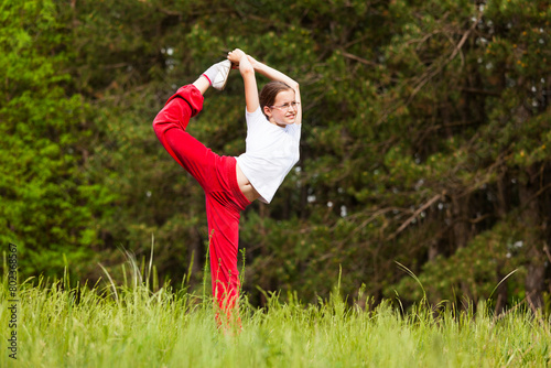 Girl practice ballet moves outdoors