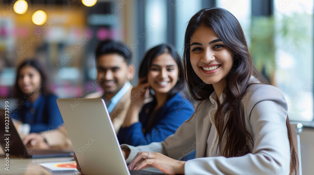 Young beautiful businesswoman or corporate employee sitting at office Young beautiful businesswoman or corporate employee sitting at office