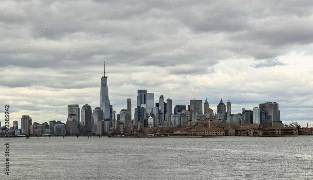 Fototapeta premium downtown manhattan skyline on a cloudy day (world trade center) one skyscraper tall buildings (financial center) hudson river, liberty state park view new york city nyc metropolis cityscape