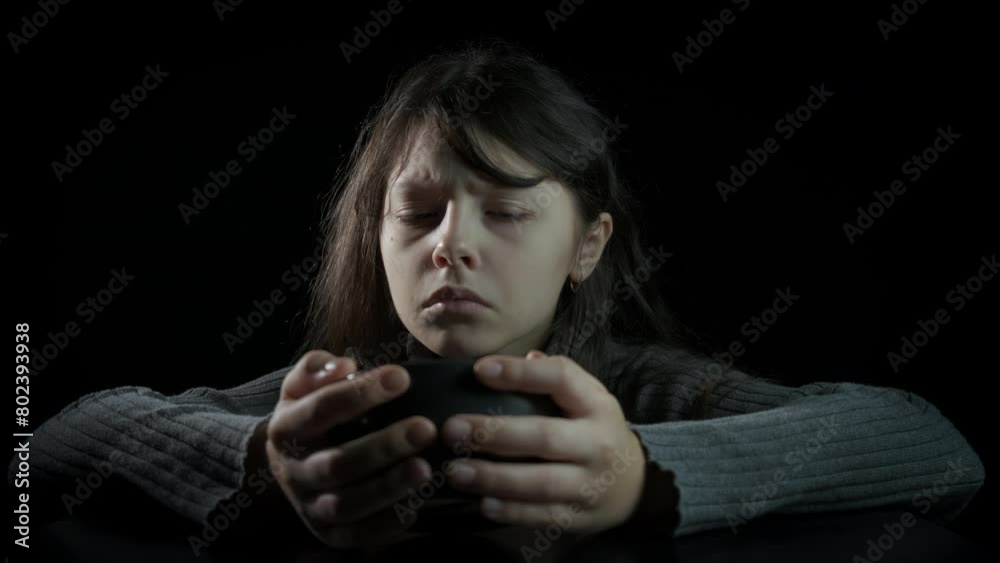 Child wait for food delivery. A hungry little girl with empty bowl waiting for food delivery during poverty time. Child wait for food delivery. A hungry little girl with empty bowl waiting for food delivery during poverty time.