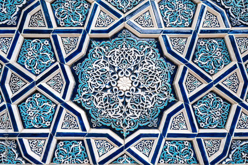 ceramic tile Uzbek mosaic with traditional oriental Arabic Islamic pattern decorated with ornament photo