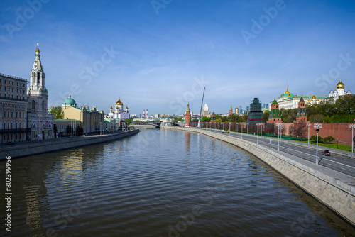 VIEW FROM THE BOLSHOY MOSKVORETSKY BRIDGE TO THE MOSCOW RIVER, THE EMBANKMENT OF THE MOSCOW KREMLIN, THE CATHEDRAL OF CHRIST THE SAVIOR ON A SUNNY SPRING MORNING
