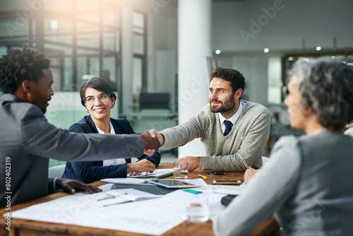 Team, diversity and partnership in handshake for business, development and project management in corporate with tech. Group, agreement and deal for ideas, strategy and collaboration for contract
