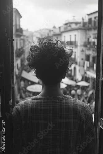 A person on a balcony overlooking a bustling street festival, observing the festivities from a private space, © Natalia