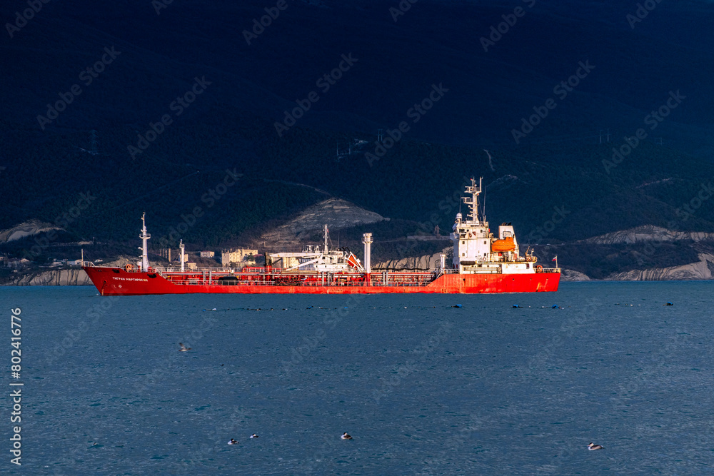 Fototapeta premium Sea freighter sailing in the middle of the ocean with big waves.
