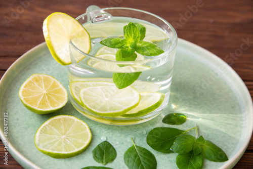 Detox water with mint leaves and lime. Healthy food rich in vitamins and antioxidants.