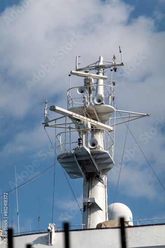 The mast of a large yacht with navigation equipment bottom view