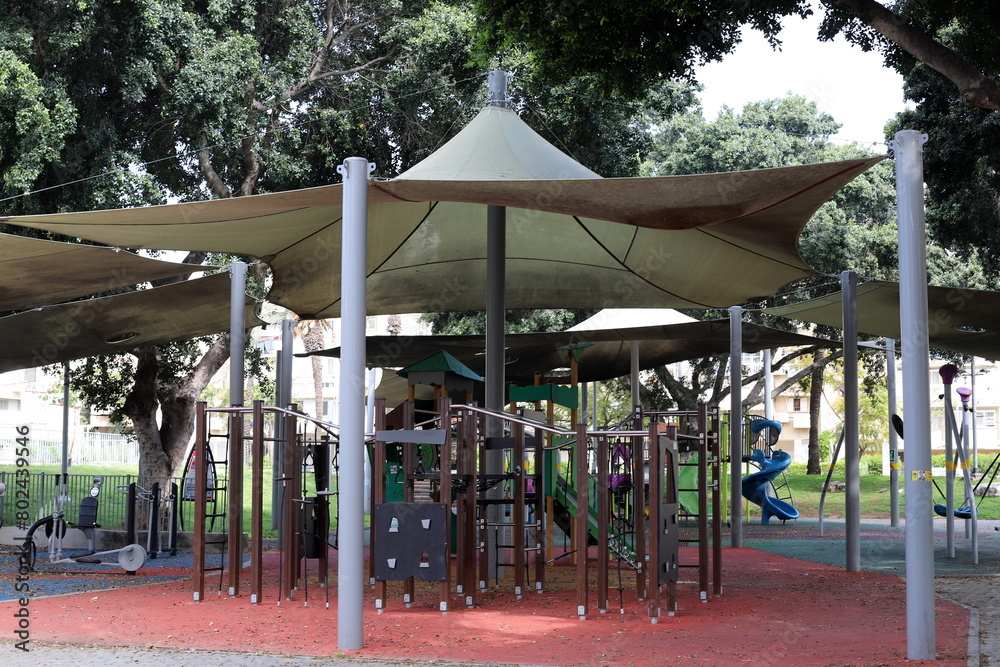 Items for games and sports on the playground in the city park. Items for games and sports on the playground in the city park.