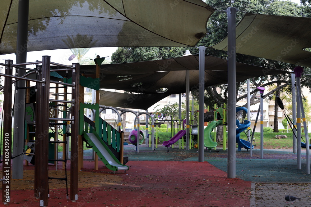 Items for games and sports on the playground in the city park. Items for games and sports on the playground in the city park.