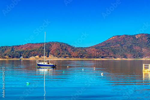 Boats and motorboats on sunny lake  in Valle de Bravo state of Mexico 