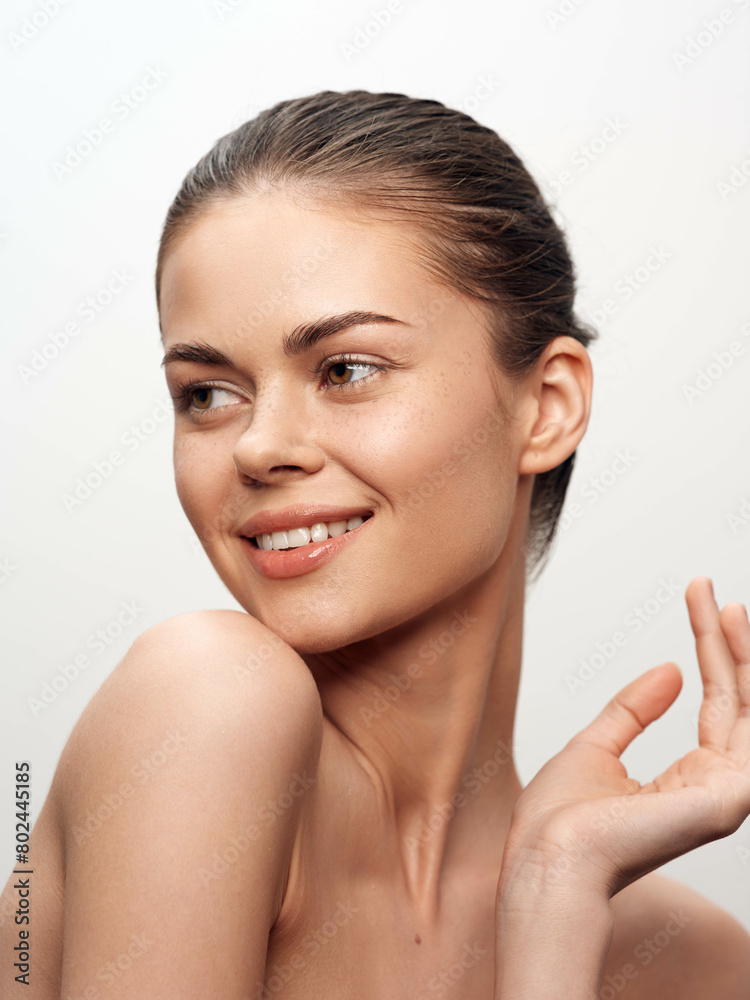 Elegant and Radiant Young Woman Posing with Hands on Face and a Bright Smile, Captivating View Elegant and Radiant Young Woman Posing with Hands on Face and a Bright Smile, Captivating View