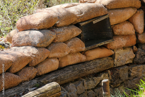 many Sandbags of a trench dug in the ground to defend army soldiers from enemy raids