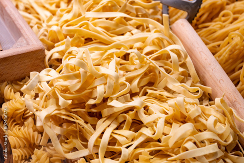 Italian food, fresh homemade pasta tagliatelle ready to cook on Portobello road food market, London photo