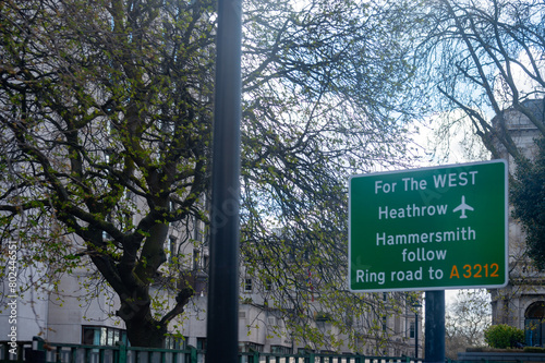 Transportation in London city, roads, road signes, street signes, warnings, indicating of directions in Great Britain, city life in England photo