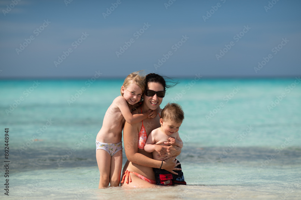 mother with children, playing with kids, family on the beach, swimming in the ocean, vacations in warm countries, Caribbean sea, Atlantic ocean, Cuba, summer vacation, summer weekend, maternity leave mother with children, playing with kids, family on the beach, swimming in the ocean, vacations in warm countries, Caribbean sea, Atlantic ocean, Cuba, summer vacation, summer weekend, maternity leave