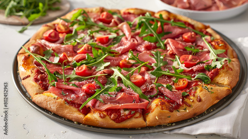 A mouthwatering pizza topped with savory prosciutto, ham, peppery arugula, juicy tomatoes, flavorful pesto, gooey cheese, and grated Parmesan cheese. A culinary delight from Italy