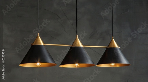 3 light chandelier, gold metal frame with black shade, geometric design in the shape of triangles hanging from ceiling to lights 