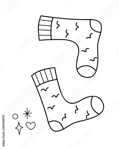 A pair of knitted socks. Doodle outline vector black and white illustration.