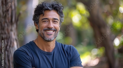 Man With Arms Crossed Standing by Tree