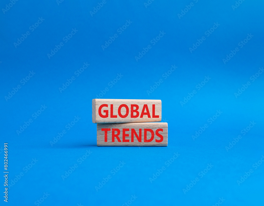 Global Trends symbol. Wooden blocks with words Global Trends. Beautiful blue background. Business and Global Trends concept. Copy space. Global Trends symbol. Wooden blocks with words Global Trends. Beautiful blue background. Business and Global Trends concept. Copy space.