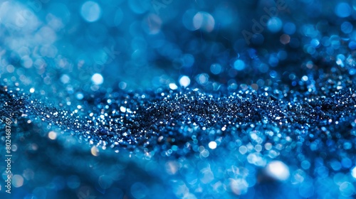 A close-up image of metallic pigment dust shimmering in blue, creating a visually striking effect