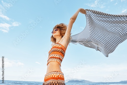 Summer Bliss: Smiling Woman Embracing Freedom and Happiness on Beach Vacation