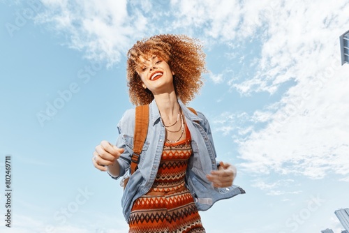 Cheerful Lady: Smiling Afro-Model with Joyful Expression, Embracing Freedom and Happiness in Natural Sunlight, Walking in a Green City Park