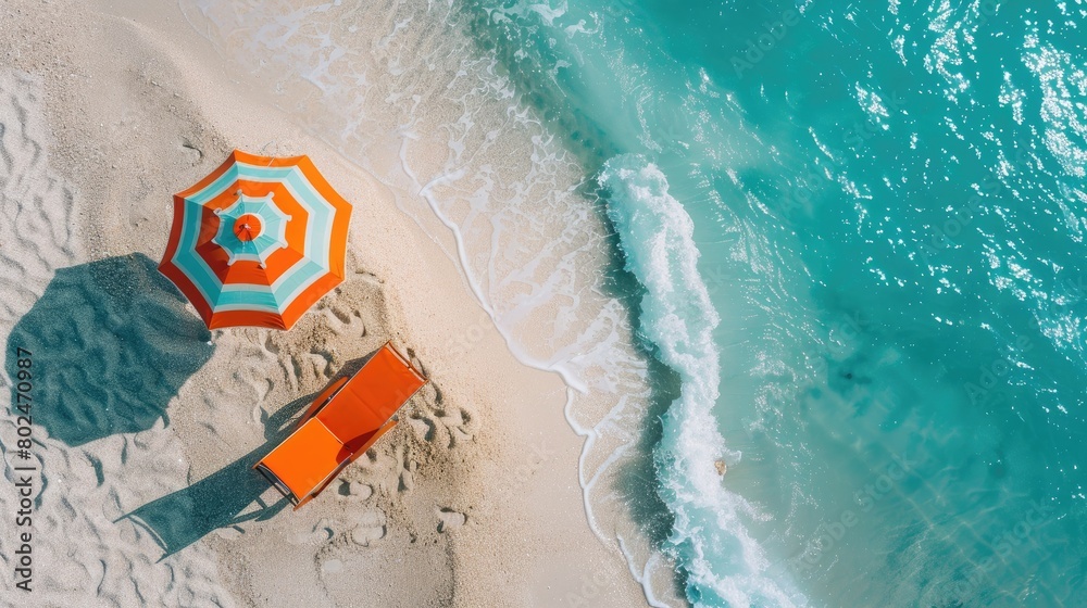 Fototapeta premium Serenity Unveiled: An Orange Beach Chair and Umbrella Basking in Coastal Bliss