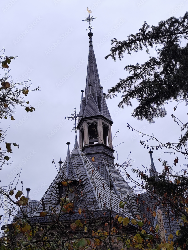 Church spire of Marienkapelle in Adenau, Germany. Catholic temple of Rheinland-Pfalz or Rhineland-Palatinate. Eifel historical building. Church spire of Marienkapelle in Adenau, Germany. Catholic temple of Rheinland-Pfalz or Rhineland-Palatinate. Eifel historical building.